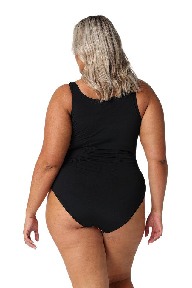 Model showing back of black floral high back swimsuit