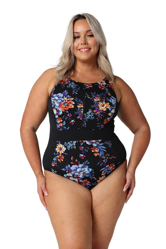 Model wearing black floral zip front one piece