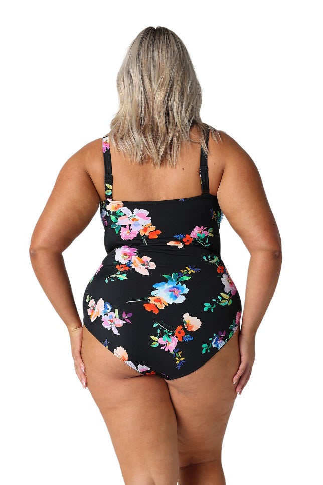 Model showing back of black floral one piece