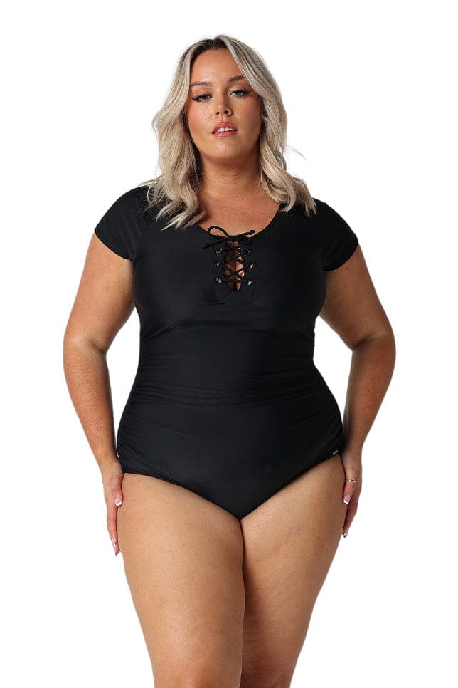 Model wearing black short sleeve tie front one piece