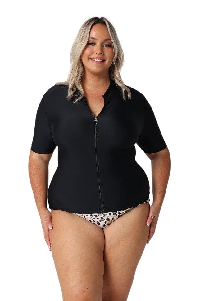 Blonde model wearing black short sleeve rash vest