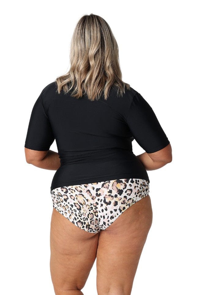 Blonde model showing back of black short sleeve rash vest