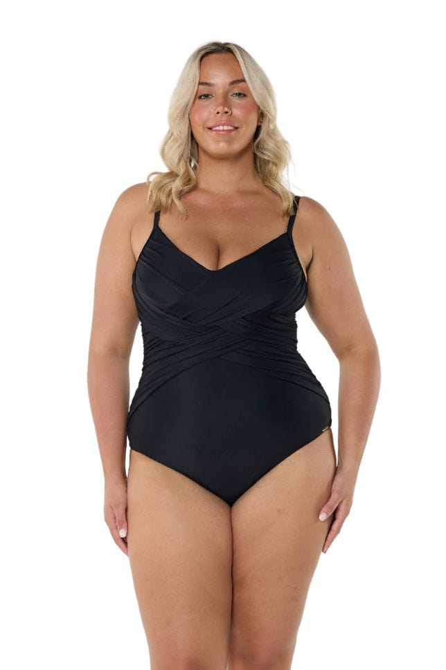 Blonde model wearing black criss cross one piece