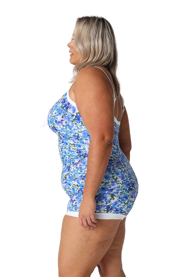 Model showing side of blue floral boyleg swimsuit