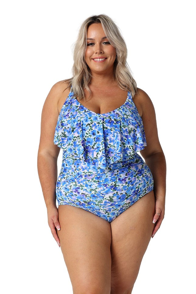 Model wearing blue floral one piece with long frill