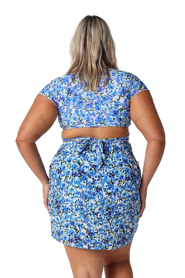 Model showing back of blue floral short sarong