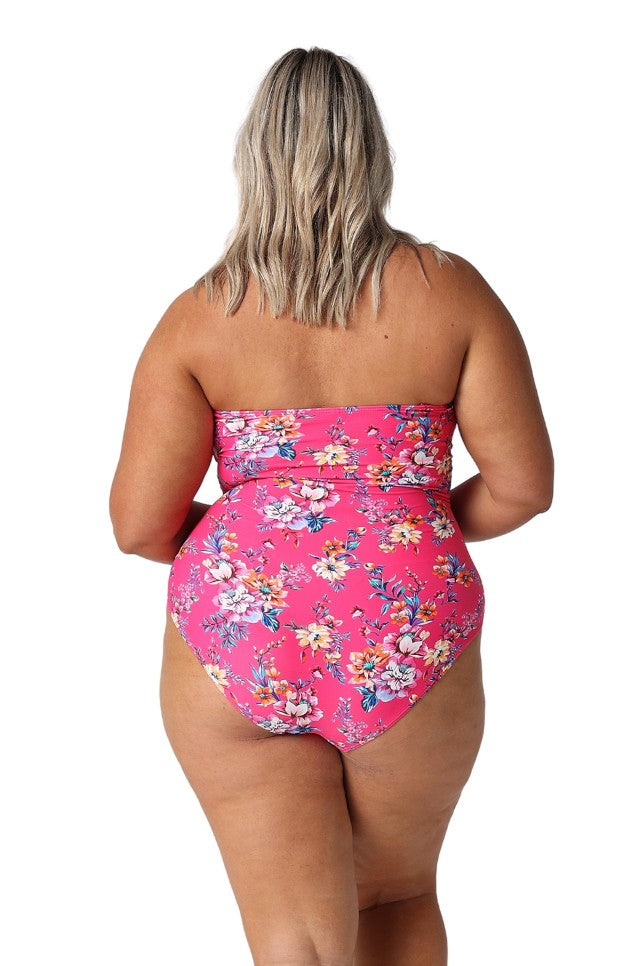 Model showing back of hot pink floral strapless one piece