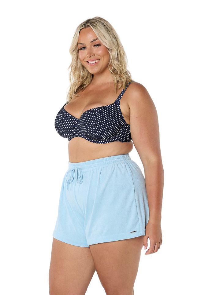 Model wearing light blue drawstring shorts