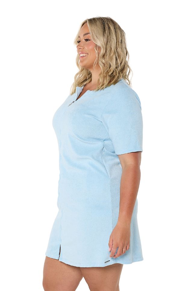 Model showing side of light blue terry towelling dress