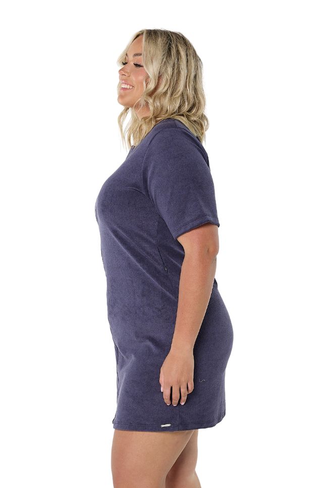 Model showing side of navy terry towelling zip up dress