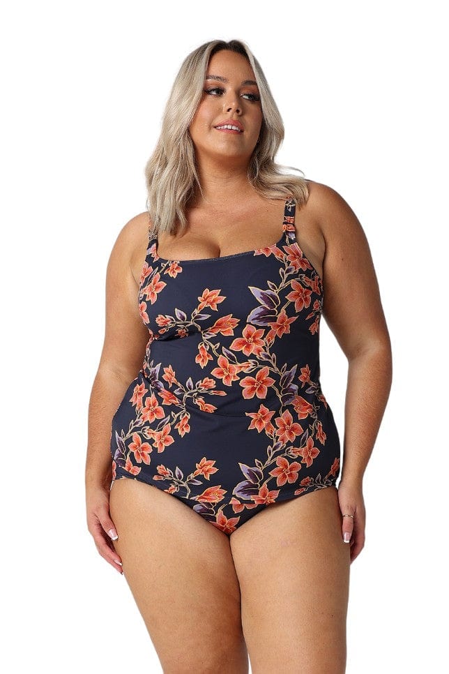 Model wearing navy and orange floral tank tankini top