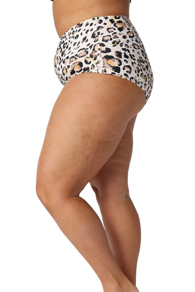 Model showing side of leopard high waisted swim bottom