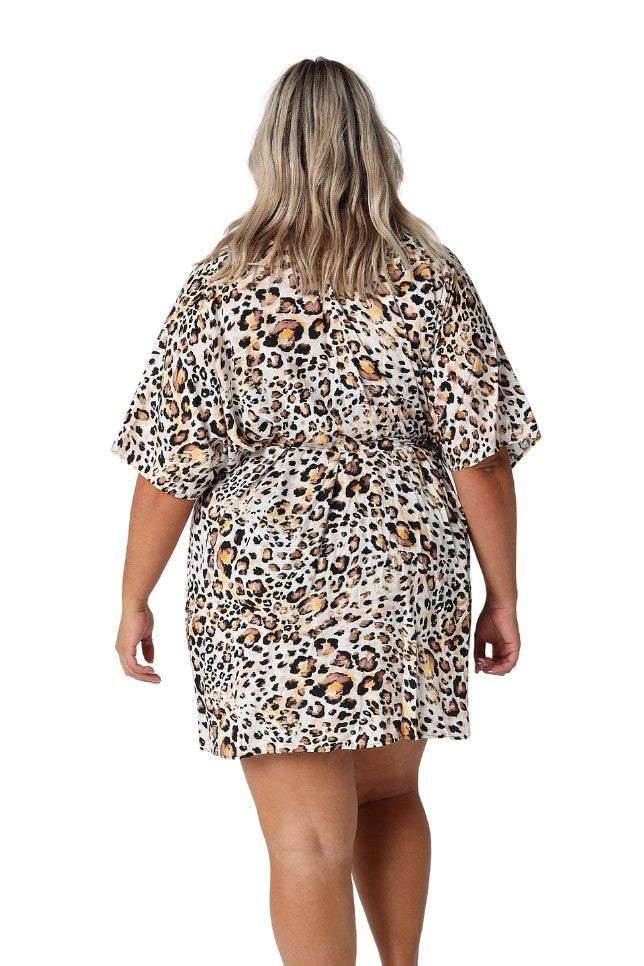 Model showing back of leopard print kaftan tied up