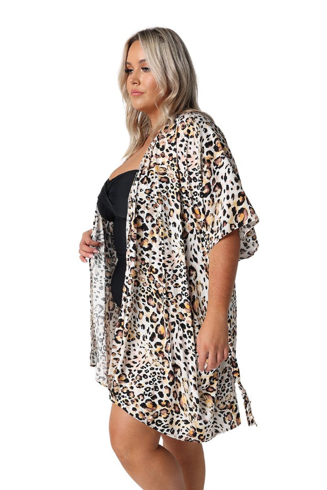 Model showing side of undone leopard print kaftan