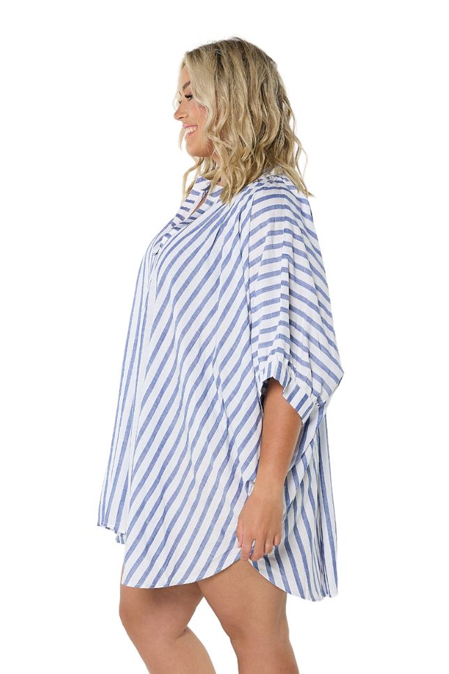 Model showing side of navy and white striped cover up