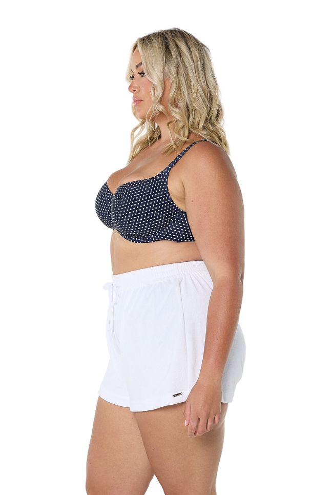 Model showing side of white terry towelling shorts