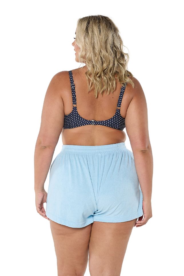 Model showing back of light blue terry towelling shorts