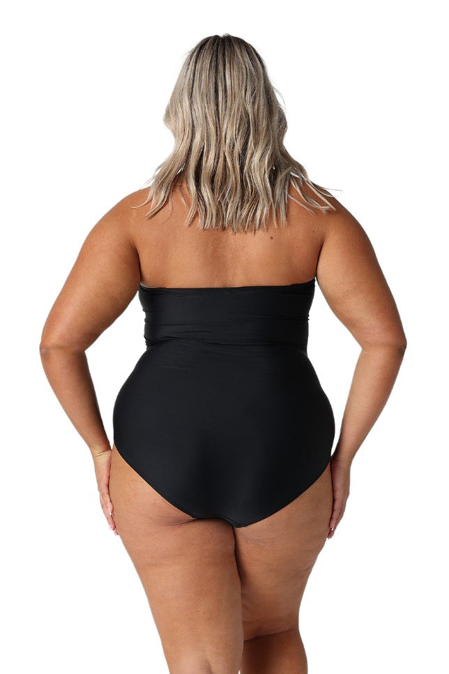 Model showing back of black strapless bandeau one piece