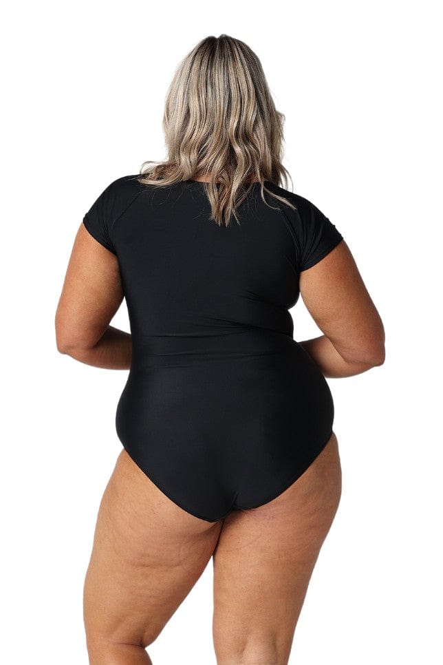 Model showing back of black tie front womens one piece