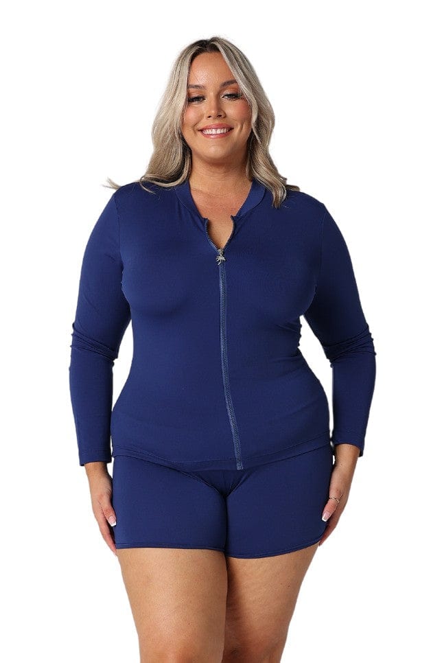 Blonde model wearing chlorine resistant navy long sleeve rash vest