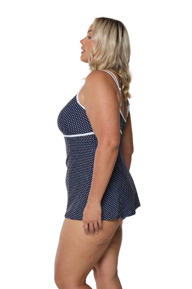 Model showing side of navy and white dots underwire swim dress