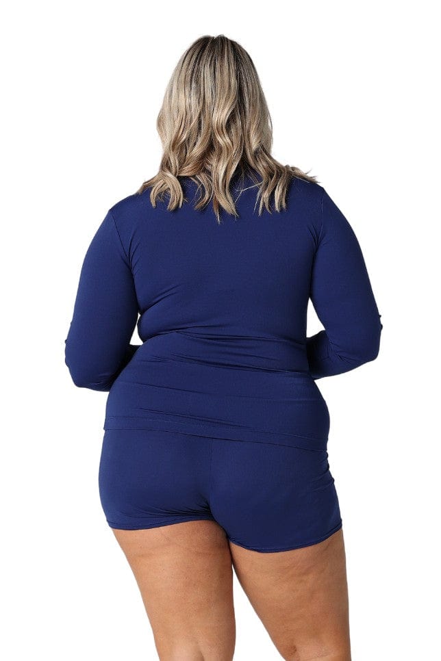 Blonde model showing back of navy long sleeve zip up rash vest