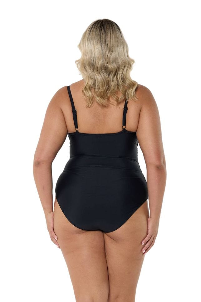 Blonde model showing back of black criss cross one piece