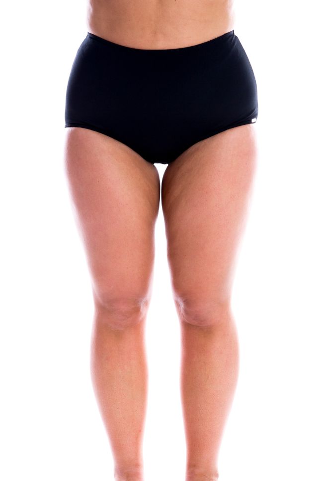 model wearing black high waisted swim bottom