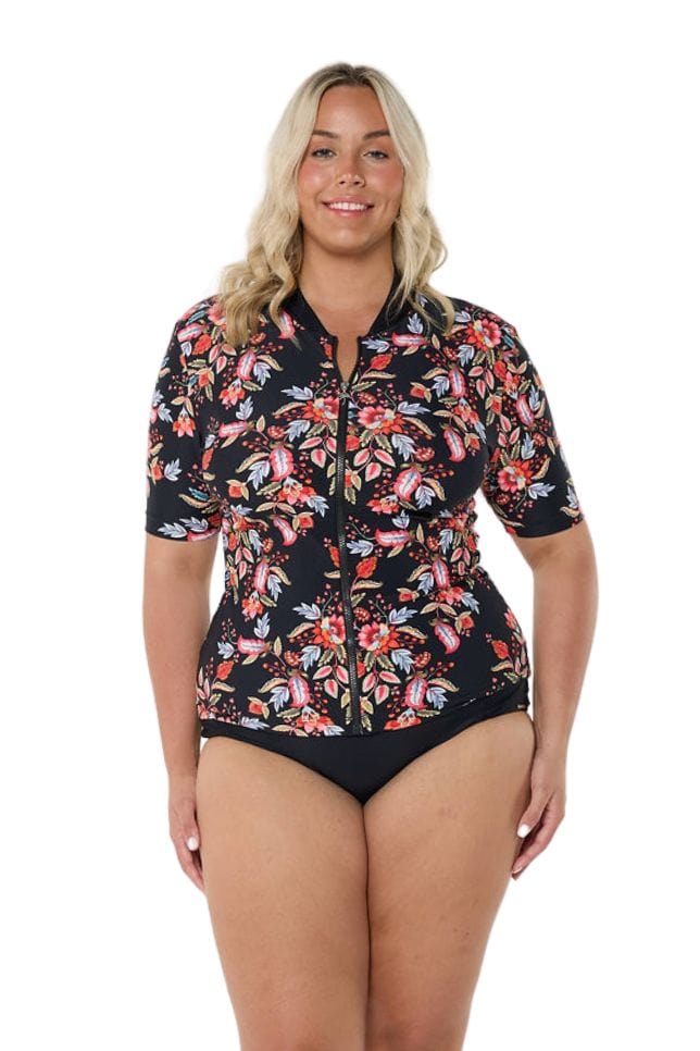 Blonde model wearing black and red floral rash vest