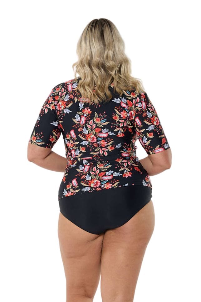 Blonde model showing back of black and red short sleeve rash vest