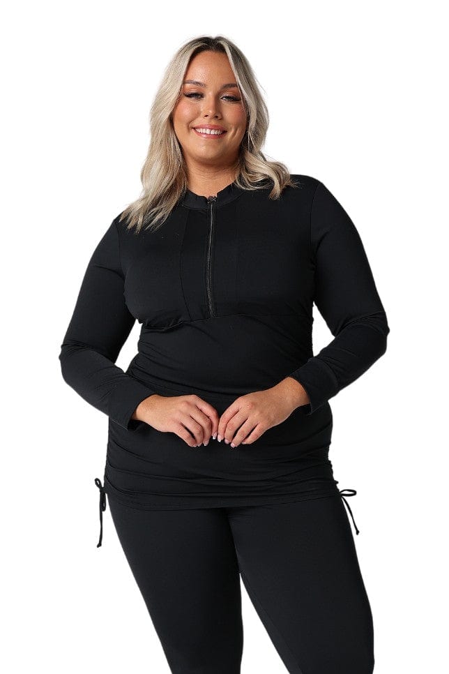 model wearing black long sleeve rashie