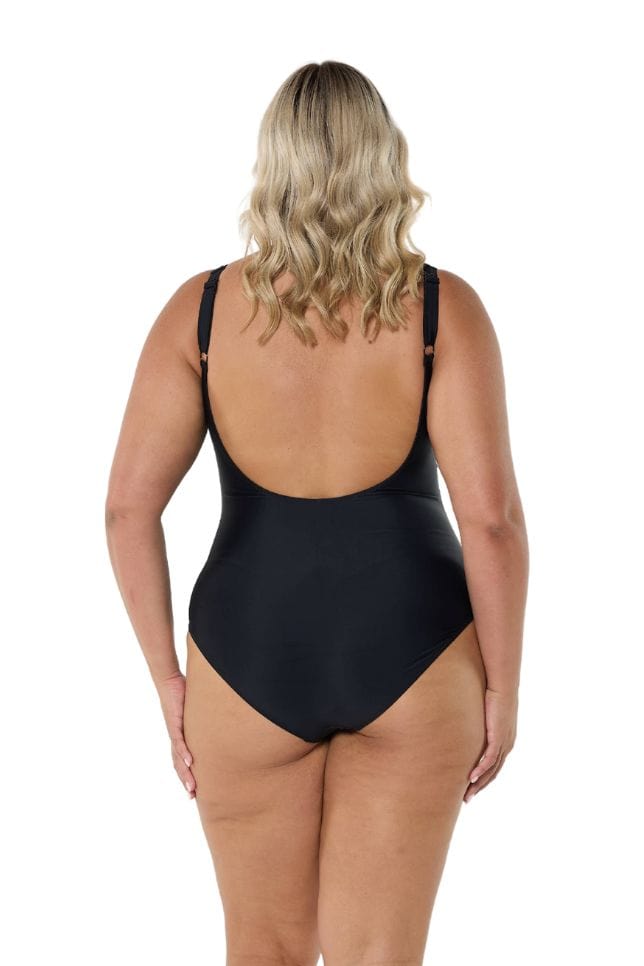 Blonde model wearing black low back one piece