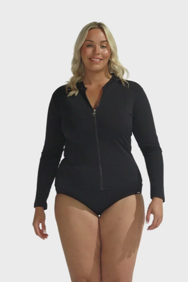 Blonde model wearing chlorine resistant black long sleeve rashie