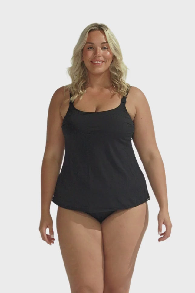 Blonde model wearing black chlorine resistant tank tankini top