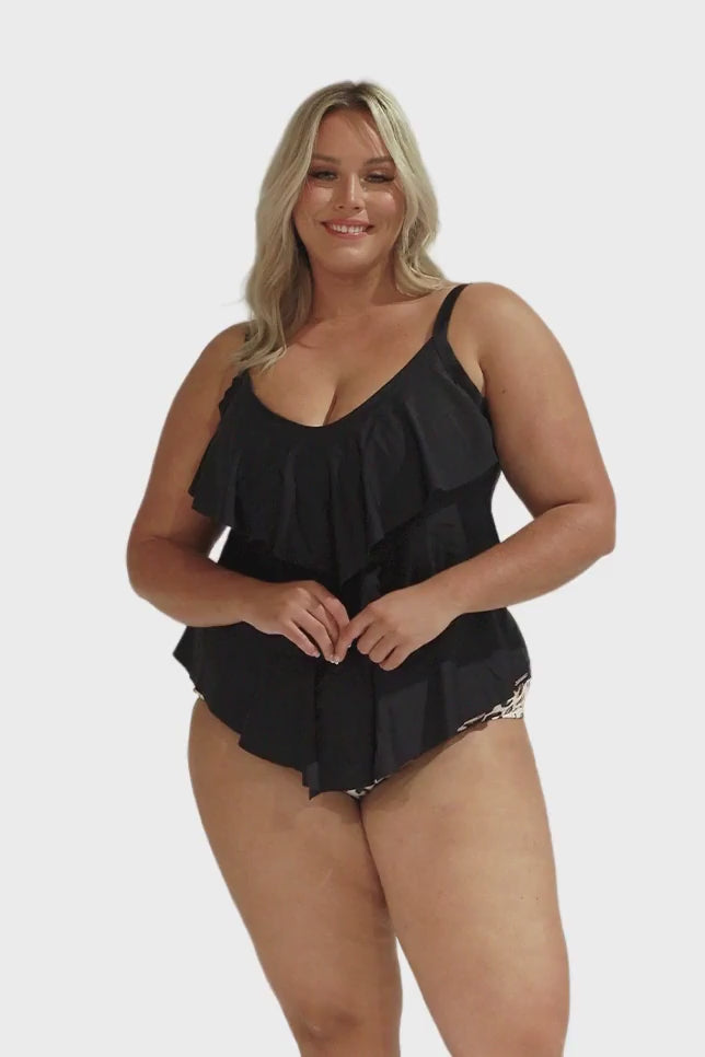 Model wearing black 3 tier tankini