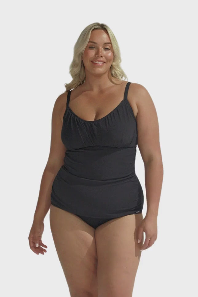 Blonde model wearing black honey comb underwire tankini