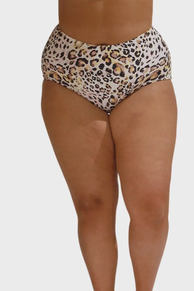 Model wearing leopard print high waisted pant