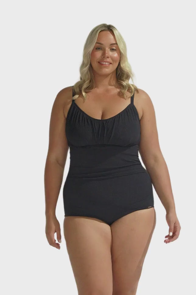 Blonde model wearing black honey comb underwire one piece