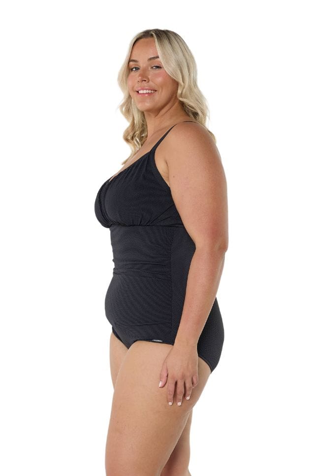 Blonde model wearing black underwire one piece