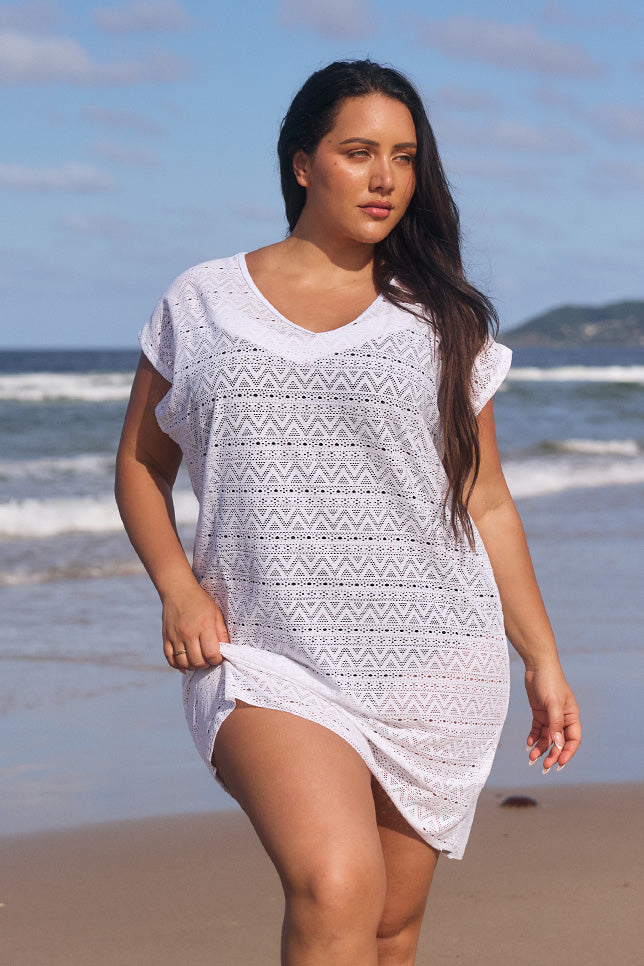 model wearing white mesh beach dress